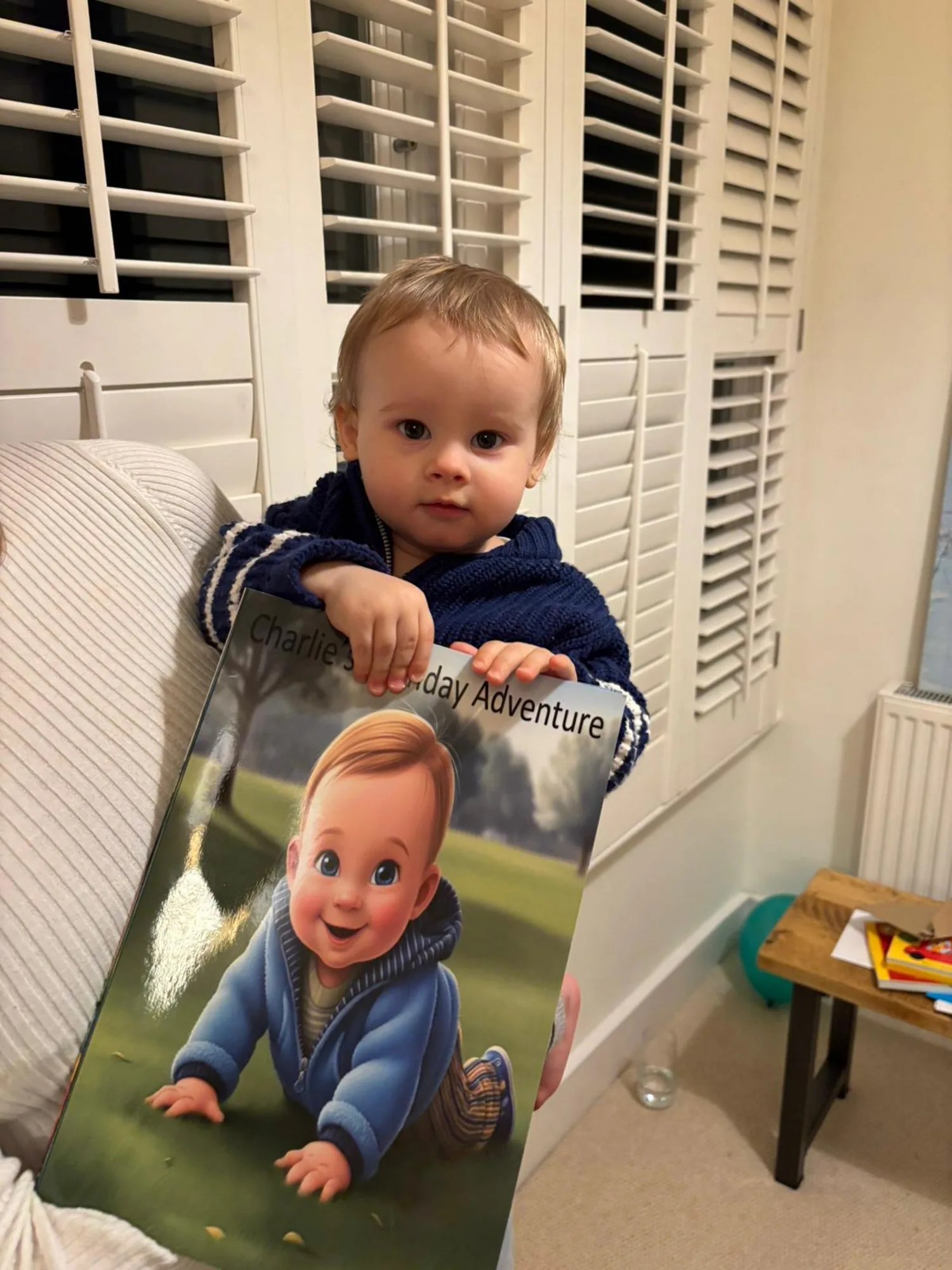 Baby holding a personalised book